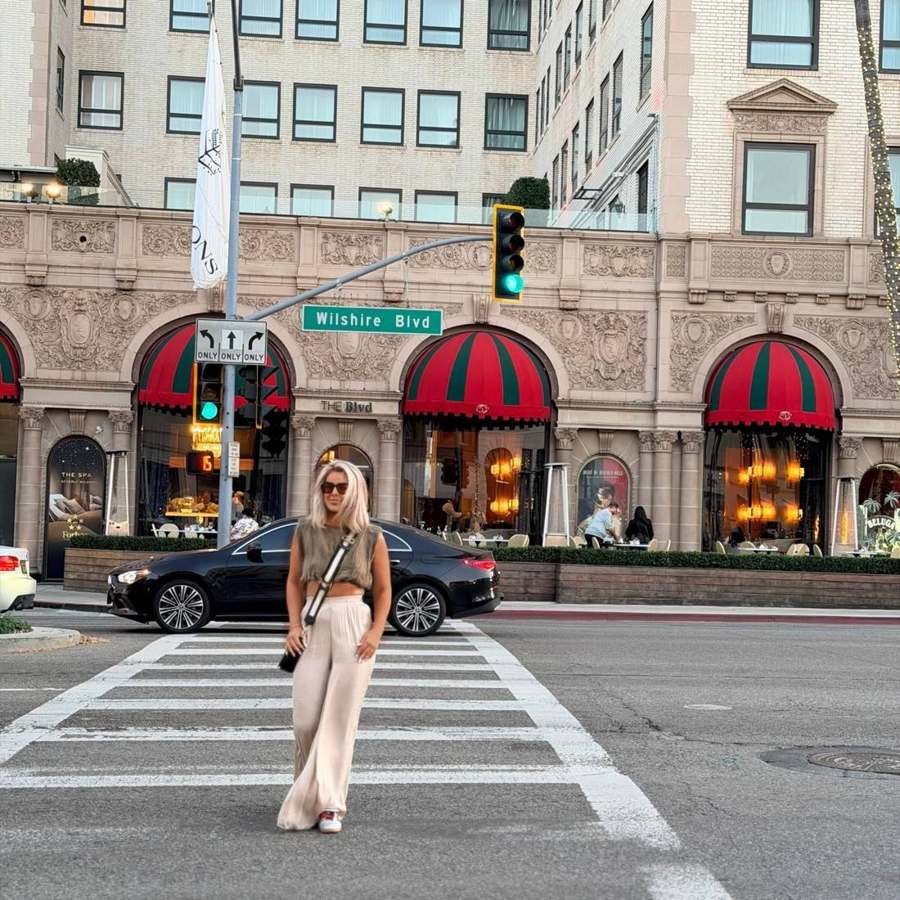 City crosswalk — silk trousers